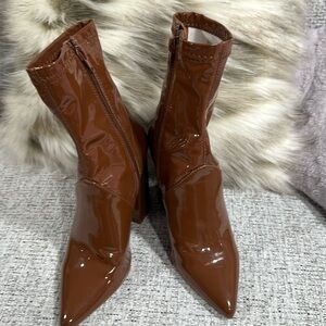 Women’s Steve Madden Patent Leather boots.   Only worn 1 time.